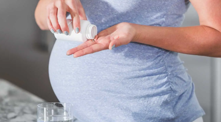 Pregnant Woman With Prenatal Vitamins